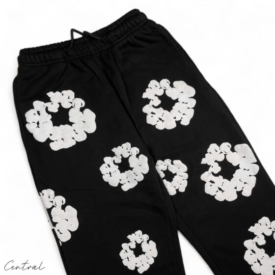 Black READYMADE x DENIM TEARS sweatpants featuring a relaxed fit and unique design details from the Central brand.