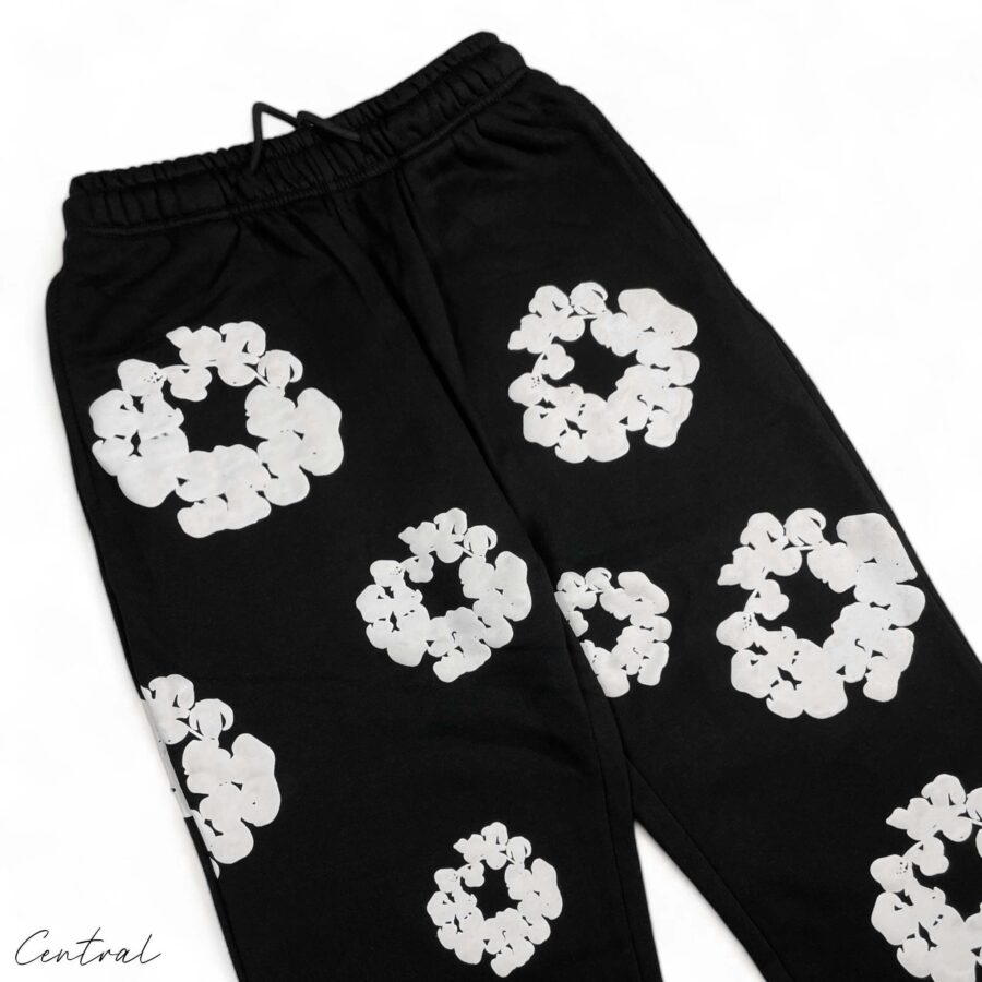 Black READYMADE x DENIM TEARS sweatpants featuring a relaxed fit and unique design details from the Central brand.