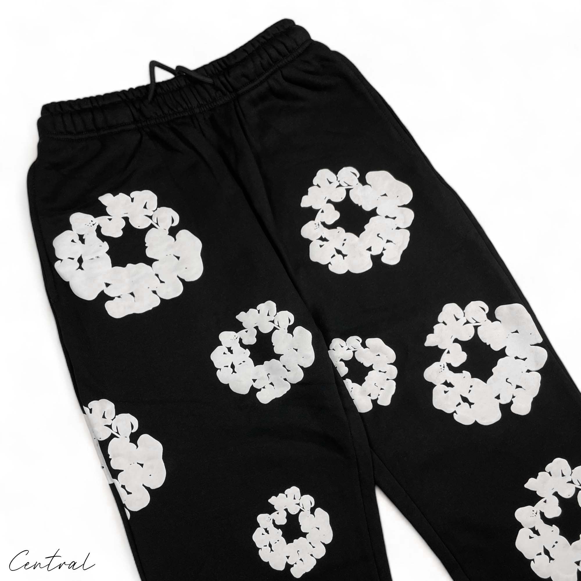 Black READYMADE x DENIM TEARS sweatpants featuring a relaxed fit and unique design details from the Central brand.