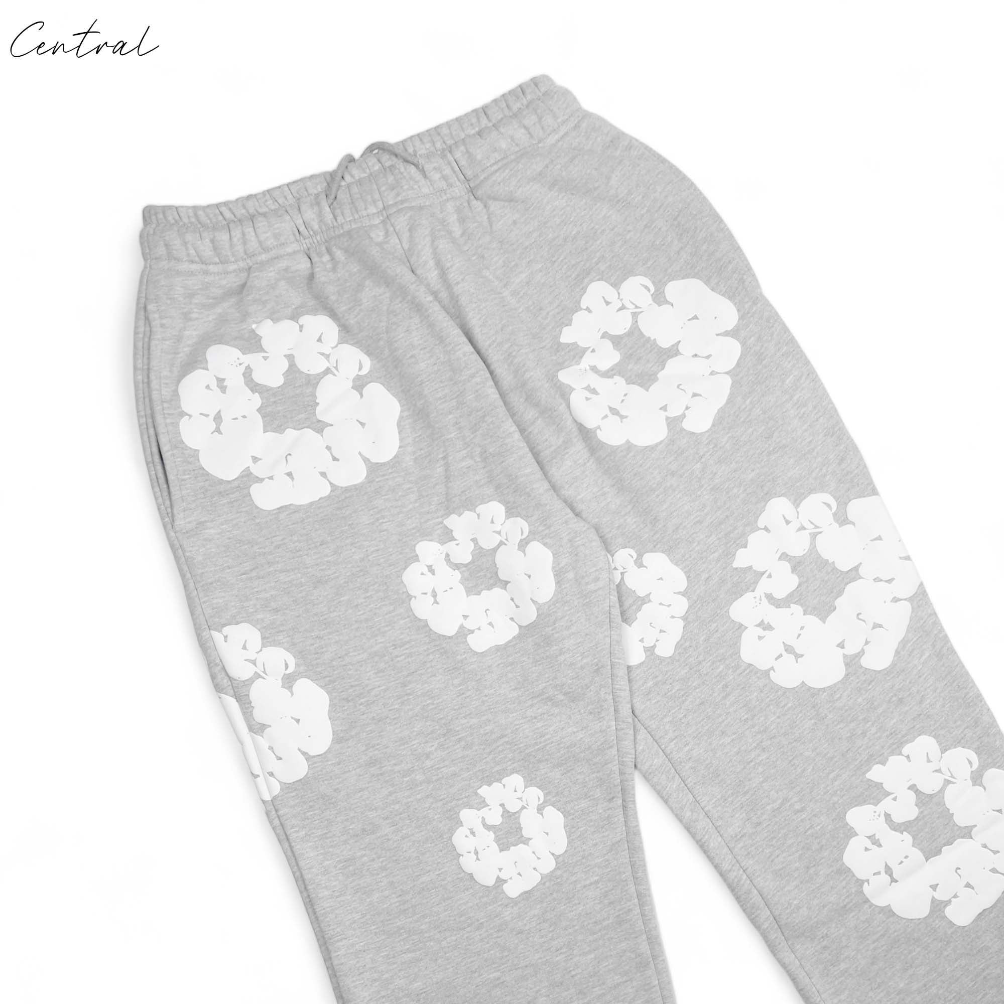 Gray READYMADE x DENIM TEARS sweatpants featuring a relaxed fit and soft fabric, displayed on a neutral background.
