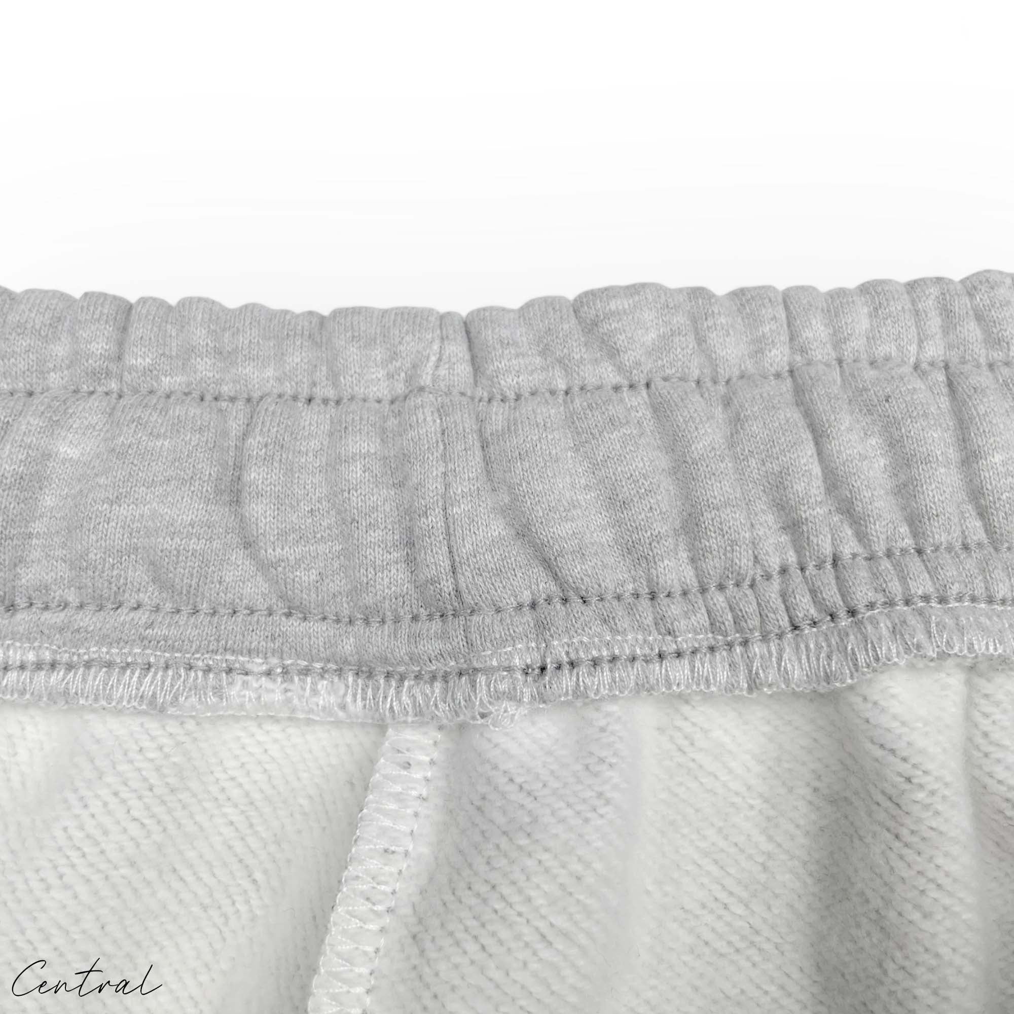 Gray READYMADE x DENIM TEARS sweatpants featuring a relaxed fit and logo details by central.