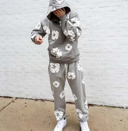 Gray READYMADE x DENIM TEARS sweatpants with an elastic waistband and side pockets, styled for comfort and casual wear.
