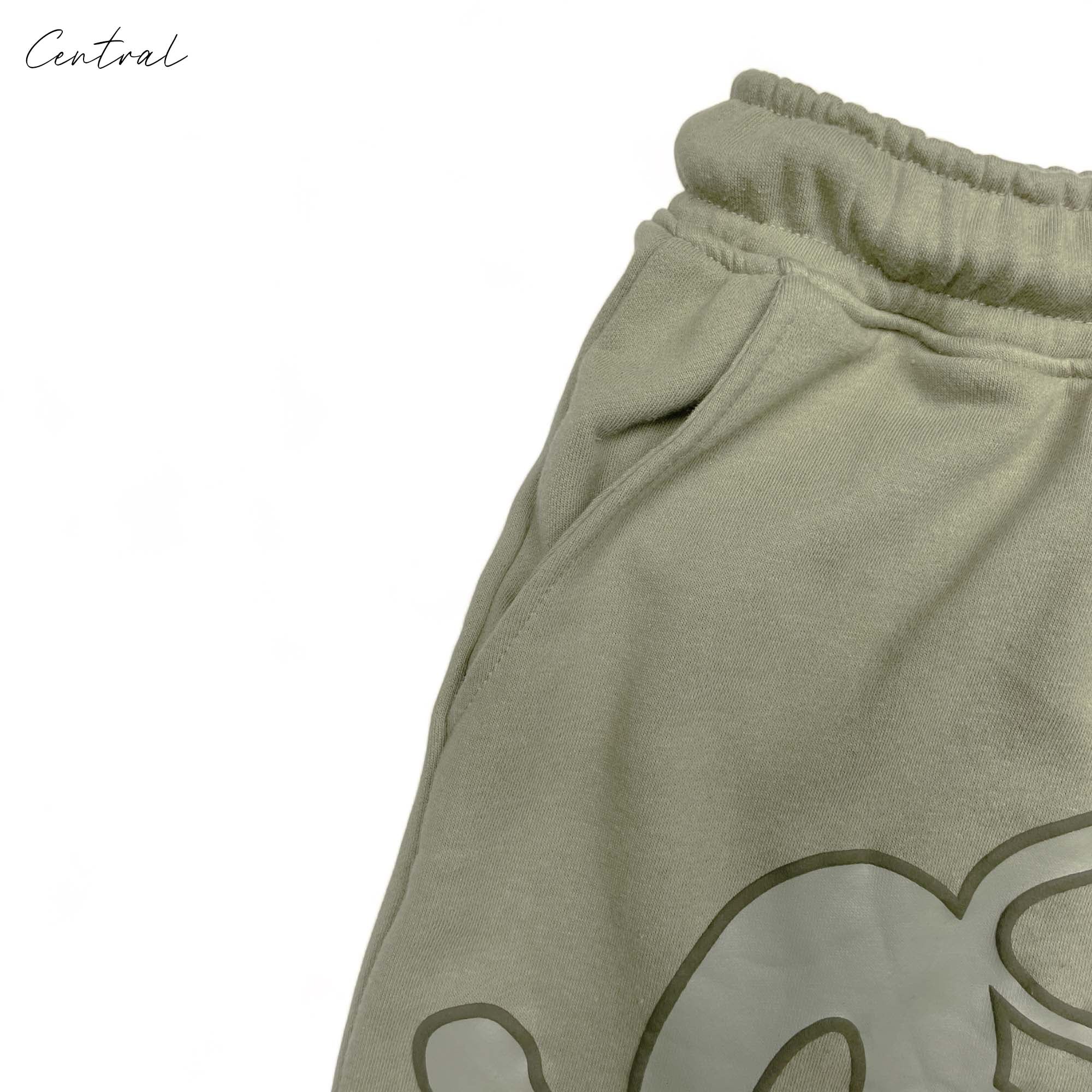 Green Syna World short set featuring a matching T-shirt and shorts by Central, displayed on a neutral background.