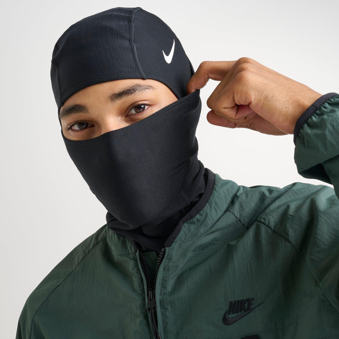 Nike Pro Hyperwarm Ski Mask in black, showcasing a snug fit and breathable fabric for winter sports.
