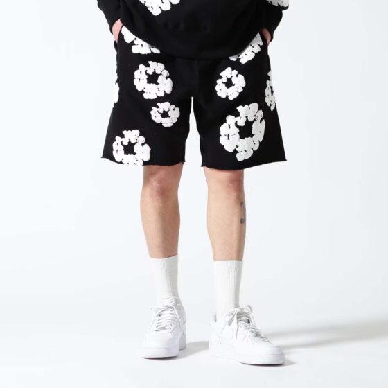 Black Denim Tears Cotton Wreath Shorts featuring a unique wreath design and stylish denim fabric.
