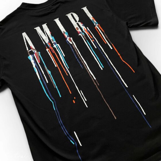 Amiri Paint Drip Black T-Shirt featuring a stylish drip design on a classic black tee.