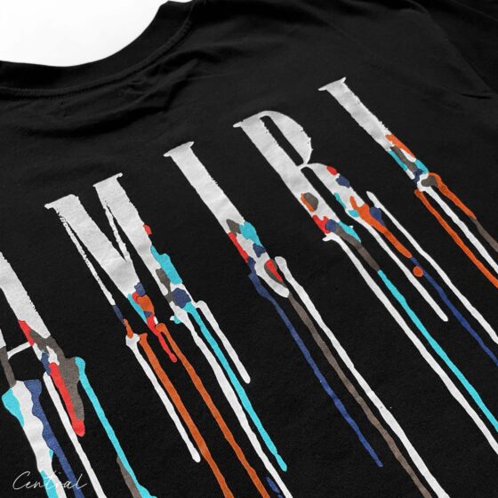 Black Amiri Paint Drip T-Shirt featuring a unique paint drip design on soft cotton fabric.