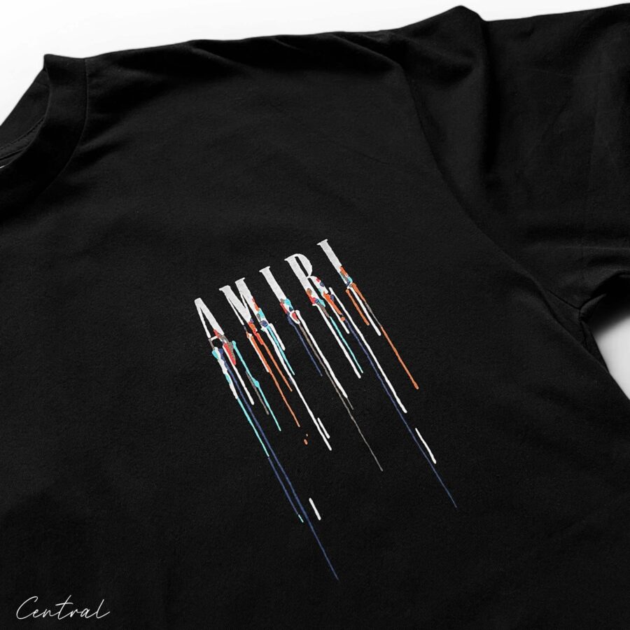 Amiri black t-shirt featuring a paint drip design, showcasing a stylish and modern casual look.