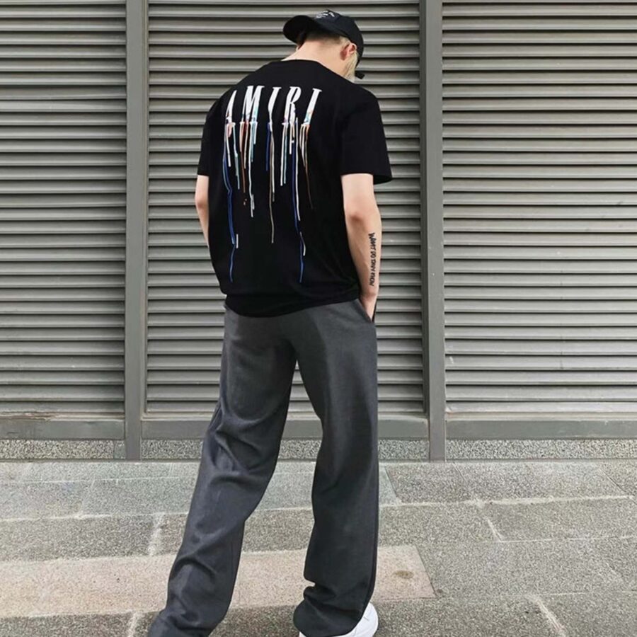 Amiri Paint Drip Black T-Shirt featuring a unique paint drip design on a classic black tee.